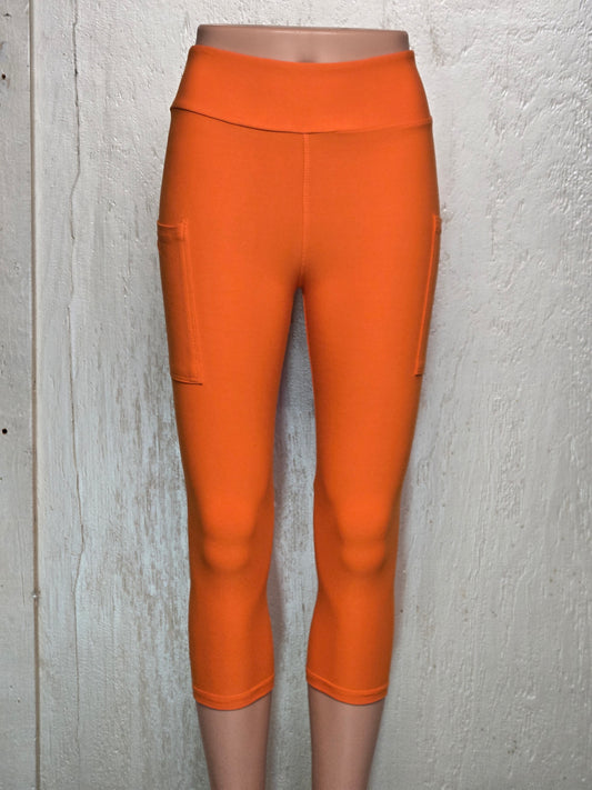 Orange capris and biker shorts with pockets