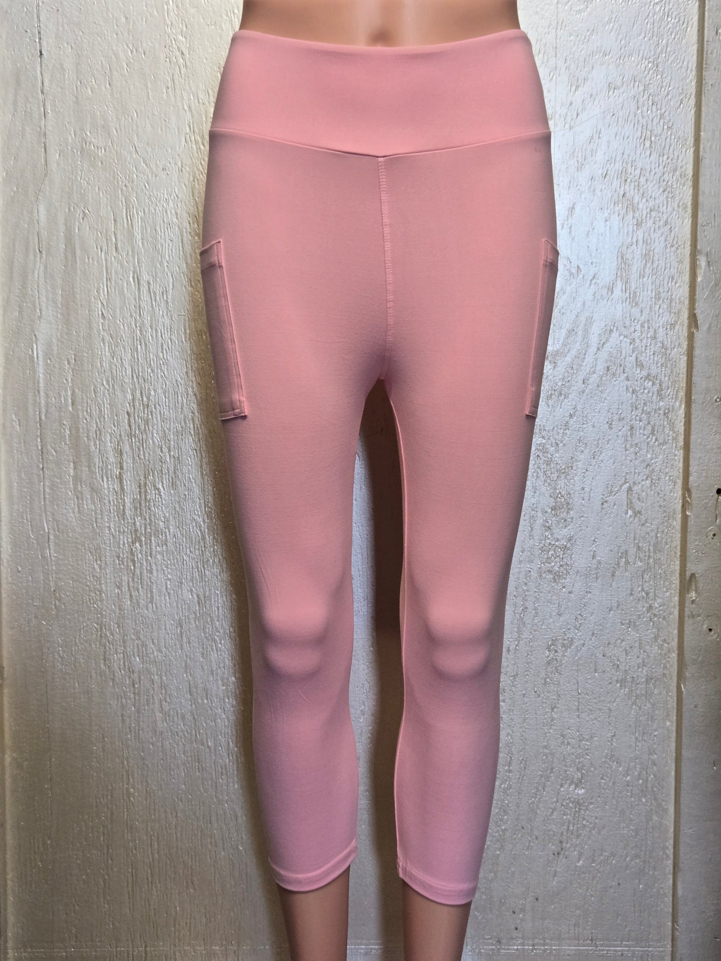 Light pink leggings, capris, and biker shorts